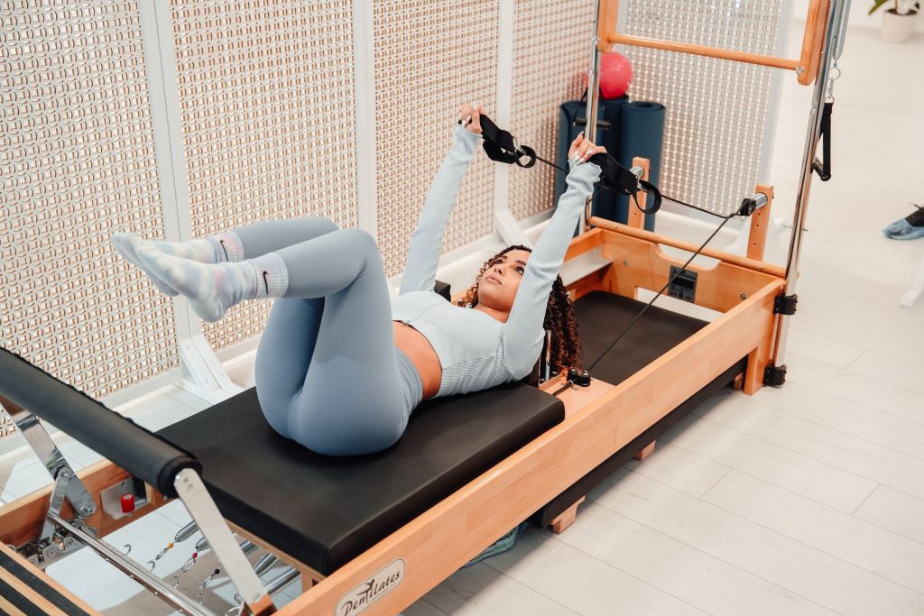 Group reformer class at Studio Pilates Bologna